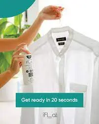 A person using a spray bottle on a white shirt hanging on a door, with the text "Get ready in 20 seconds."